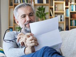 Man reviewing his annual social security letter before calling Scott Nissen at Nissen and Associates