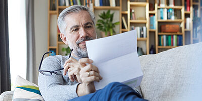 Man reviewing his annual social security letter before calling Scott Nissen at Nissen and Associates