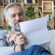 Man reviewing his annual social security letter before calling Scott Nissen at Nissen and Associates