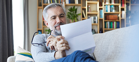 Man reviewing his annual social security letter before calling Scott Nissen at Nissen and Associates