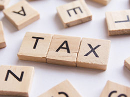 Understanding Tax lingo - tax is spelled out in scrabble letters