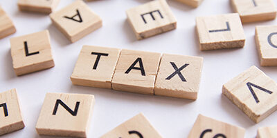 Understanding Tax lingo - tax is spelled out in scrabble letters