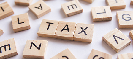 Understanding Tax lingo - tax is spelled out in scrabble letters