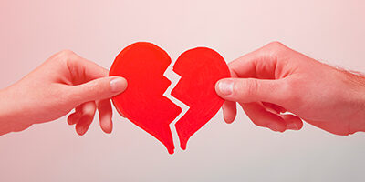 Life Events That Affect Taxes, Two hands tug, breaking a heart. Learn more about how life events like divorce, separation, widow or marriage can affect your taxes