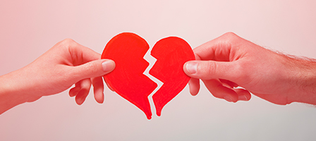 Life Events That Affect Taxes, Two hands tug, breaking a heart. Learn more about how life events like divorce, separation, widow or marriage can affect your taxes