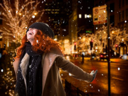 woman outside at night downtown Bellingham overjoyed about the Tax Changes for 2020