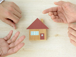 Did you pay tax on home mortgage debt relief in 2018? You may be entitled to a refund. A toy sized house rests between two sets of hands that are engaged in a lively discussion between themselves.