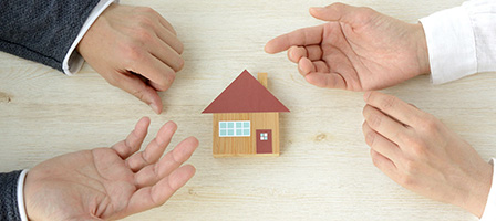 Did you pay tax on home mortgage debt relief in 2018? You may be entitled to a refund. A toy sized house rests between two sets of hands that are engaged in a lively discussion between themselves.