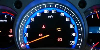 Interior dashboard of a car shows the standard mileage rates 2020