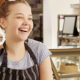 New Twist For Kiddie Tax With A Refund Opportunity A young female child is laughing as she stands in a kitchen with an apron on.