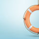 Stimulus Legislation Includes SBA Loan Forgiveness, a life preserver hangs waiting against a blue backdrop.