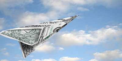 How Much Will I Get from The Covid-19 Stimulus Rebate Program? A paper airplane sails through a blue sky