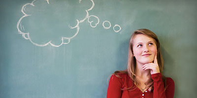 Trying to cheat the IRS? Think again! visual of a woman against a chalkboard visualizing