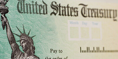 Still Waiting for The IRS To Cash Your Check? A photo of a IRS check - close up and personal