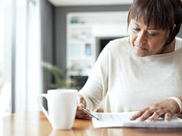 A woman looks over her tax return, checking out the full array of Tax Planning Opportunities