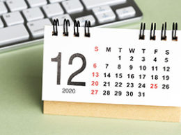 Tax Issues to Be Aware of as Year-End Approaches. A calendar sits out on a desk near a laptop