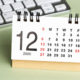 Tax Issues to Be Aware of as Year-End Approaches. A calendar sits out on a desk near a laptop