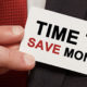 Tax Deductions Without Itemizing, a man wearing a business suit is holding a card stating "Time to save money"