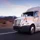 2024 Standard Mileage Rates Announced - a commercial truck driving on a featureless desert highway.