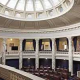 Interior of a classical chamber with a domed ceiling, balcony seating, and ornate columns where Tax Changes for Seniors takes place.