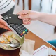 Customer paying for a meal with a card using a portable payment terminal wondering if there will be a Tax Deduction for Tips